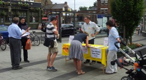 The campaign continues: collecting petition signatures and talking to residents outside Raynes Park Station on 28 June 2015.